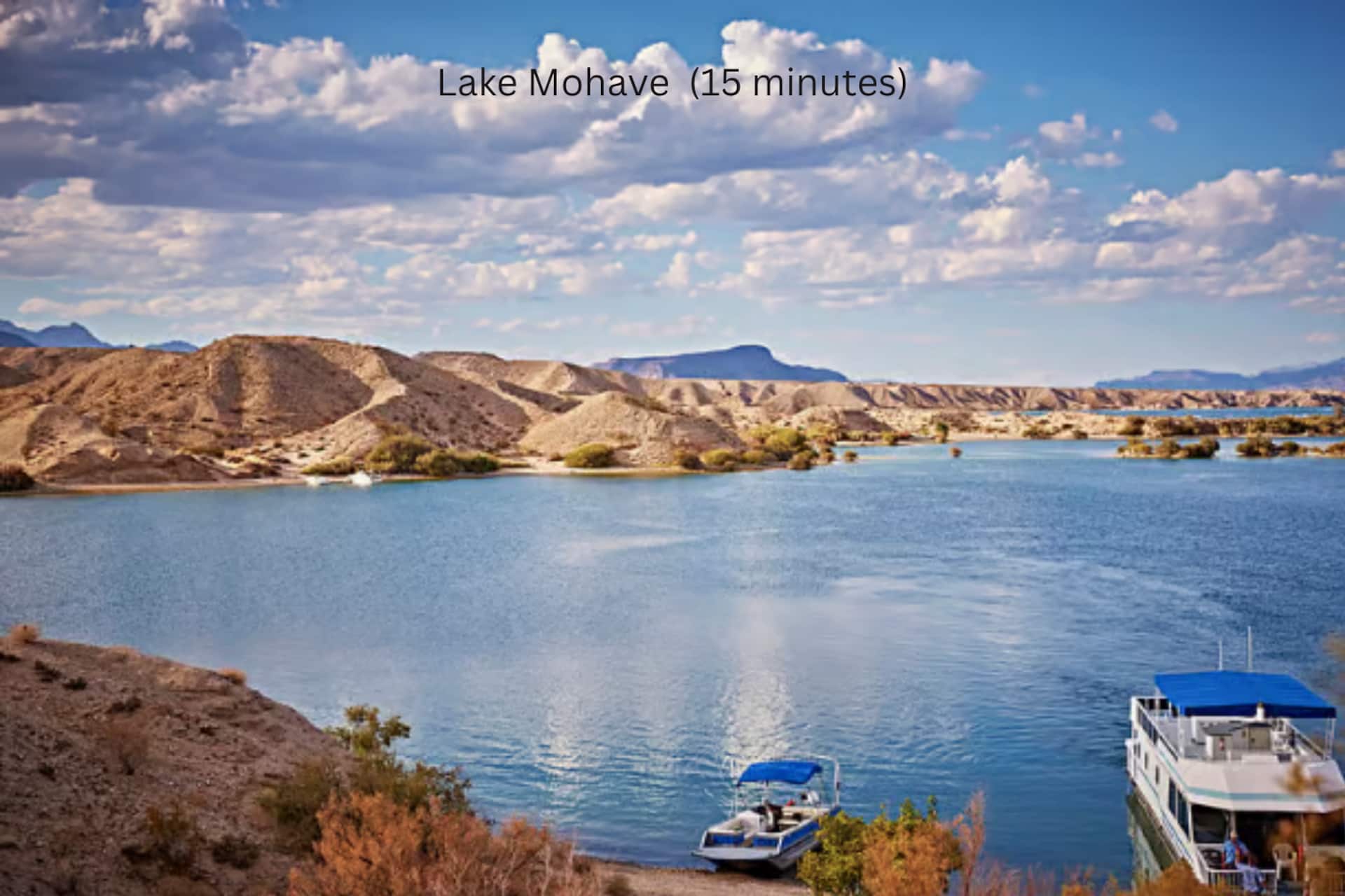 Lake Mohave with boats and desert hills