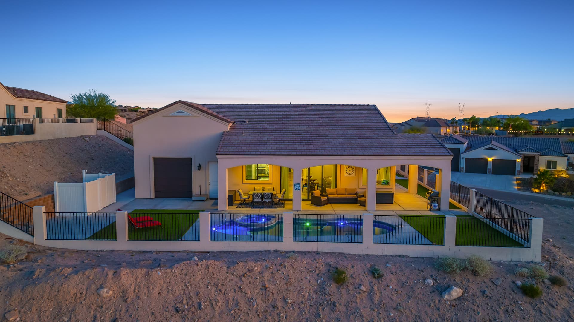 Rear exterior with pool at sunset