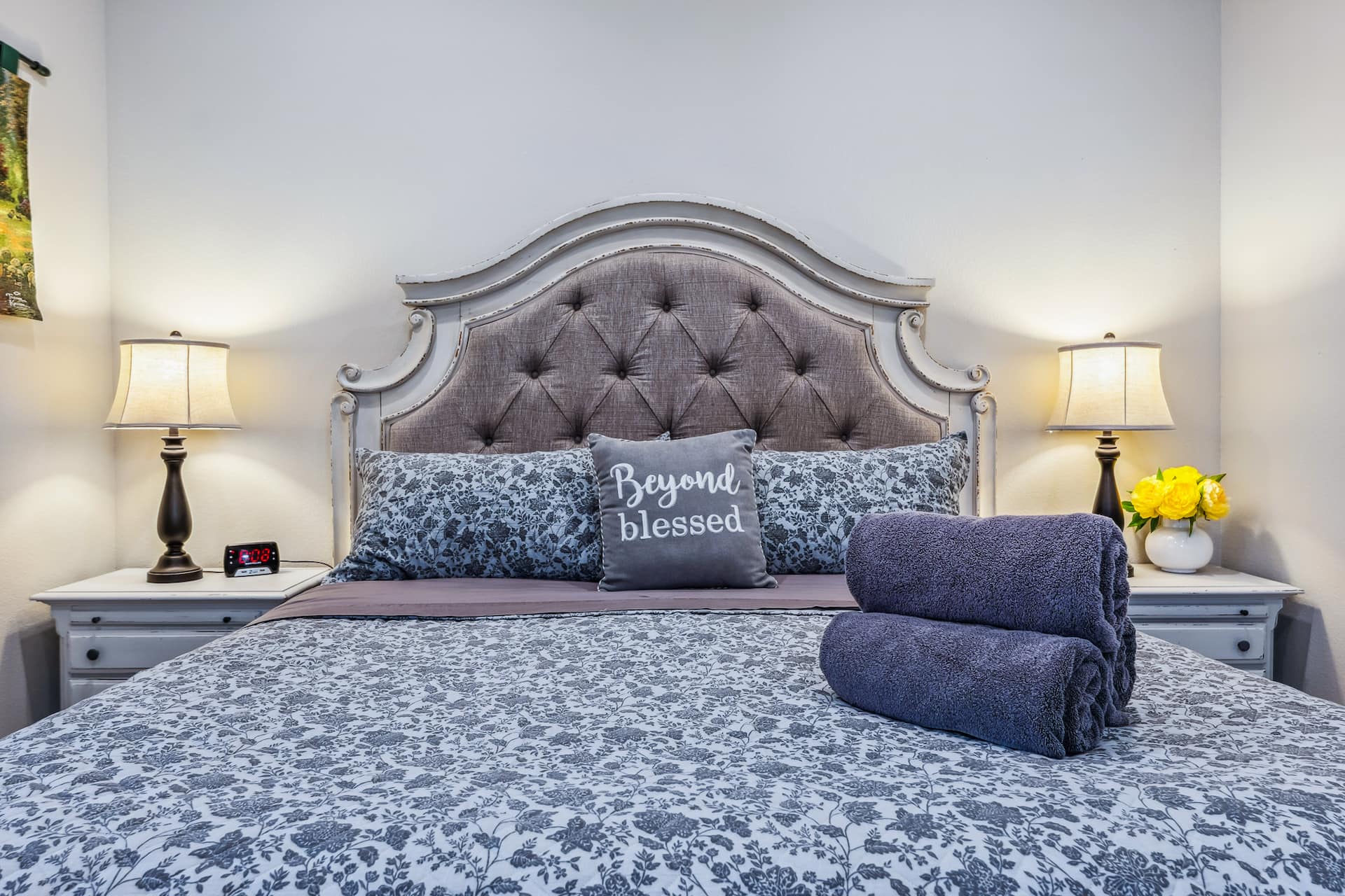 King bedroom with tufted headboard