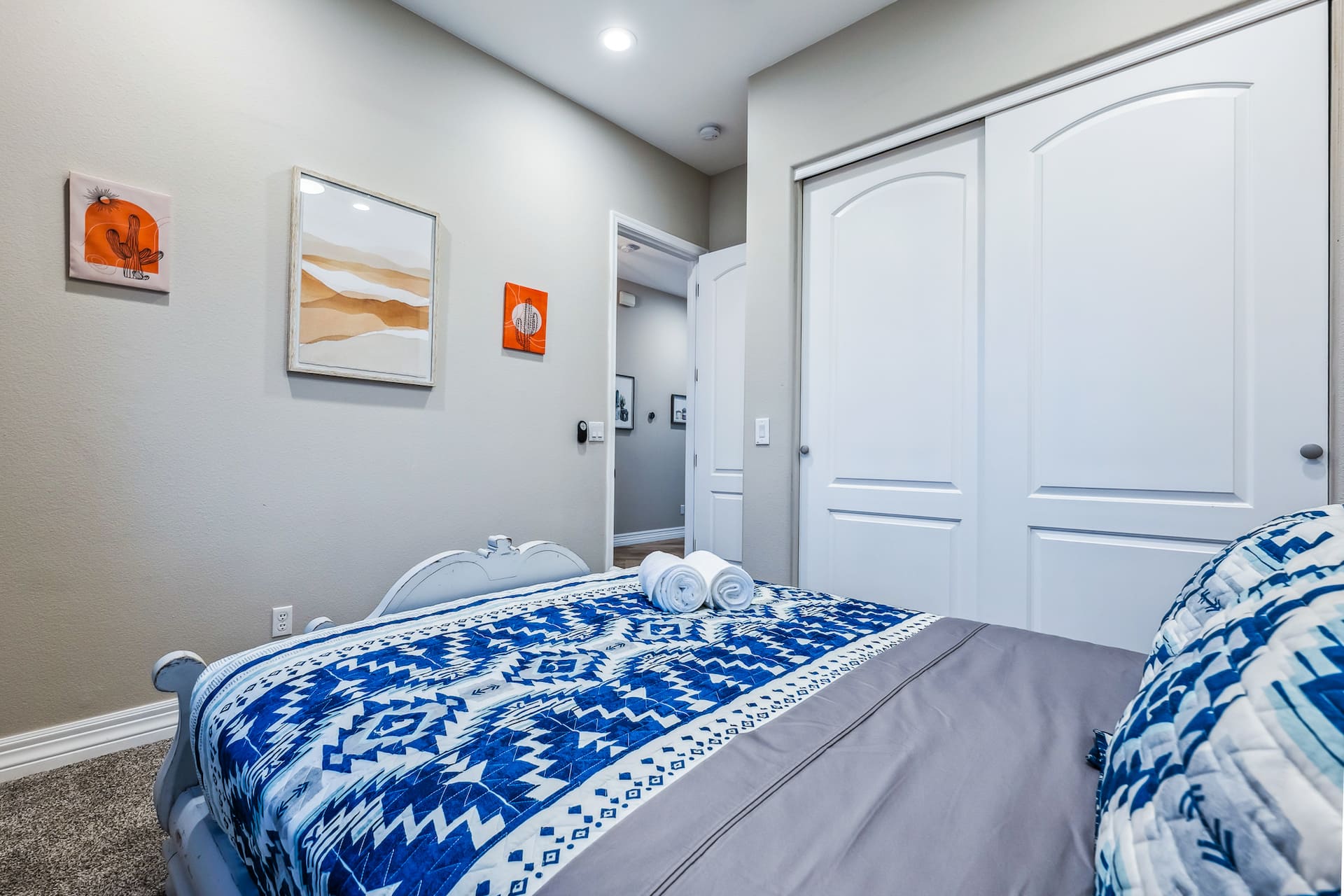 Queen bedroom with desert art