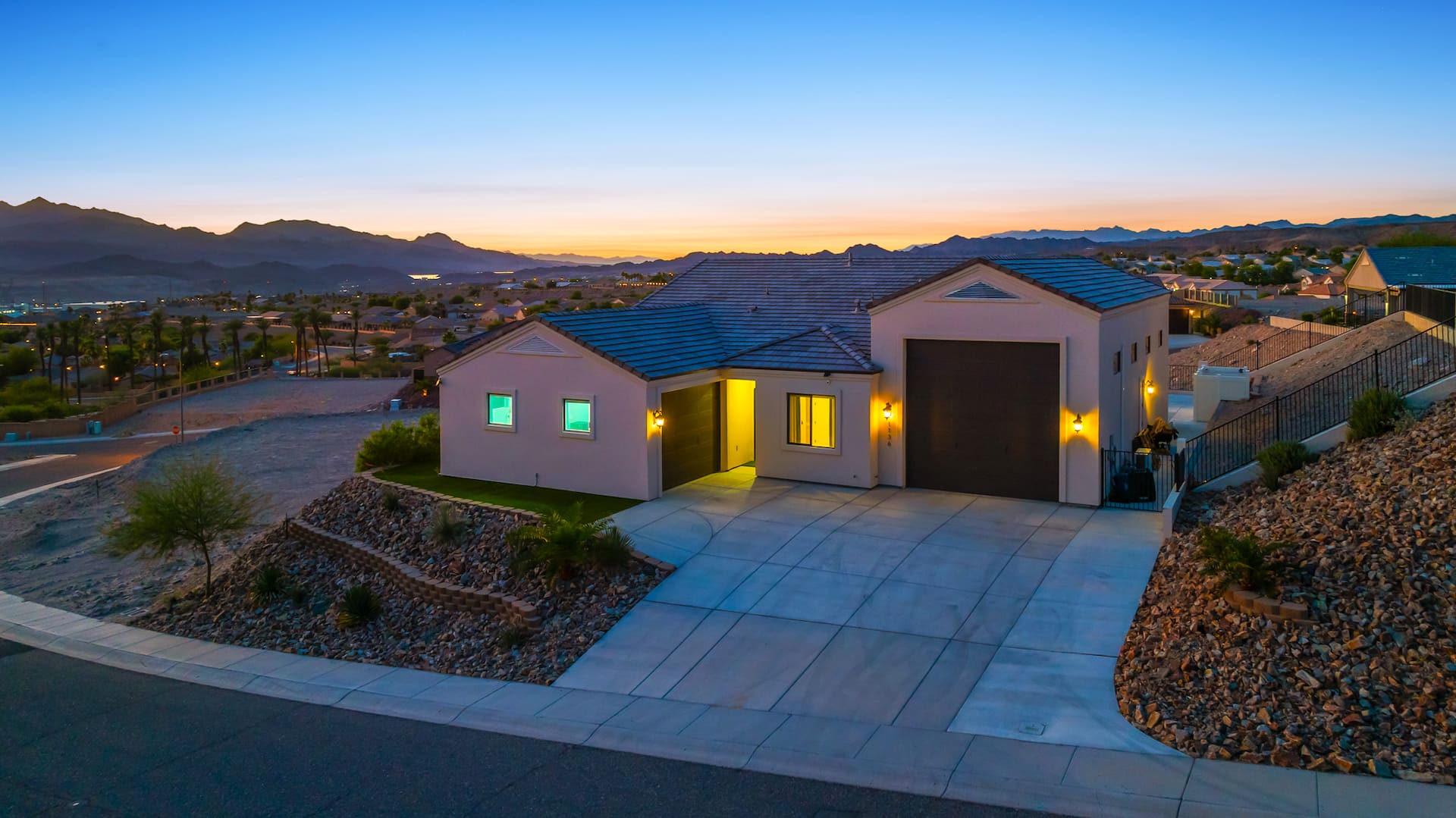 Home exterior aerial view at twilight