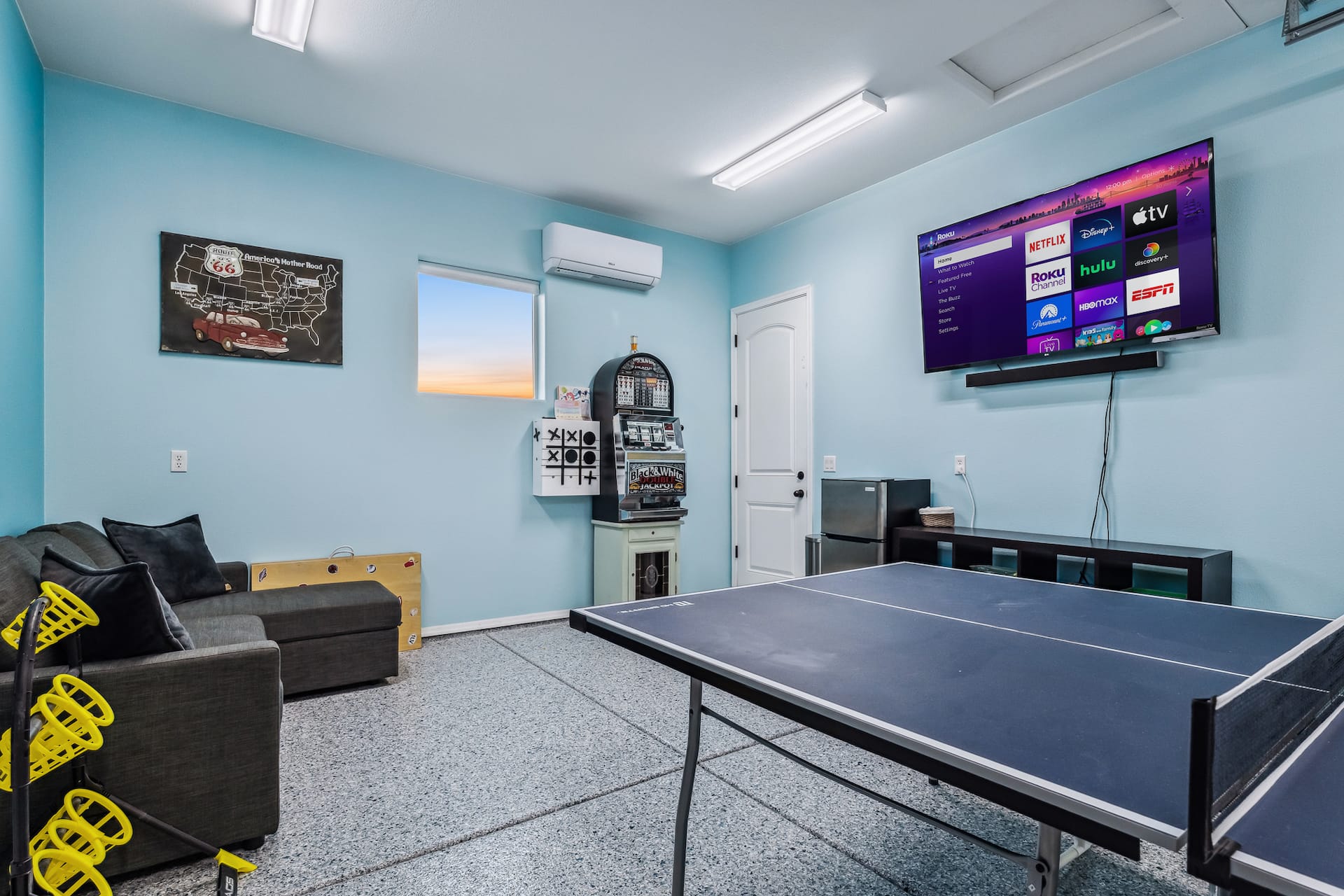 Game room with ping pong, cornhole, and streaming TV