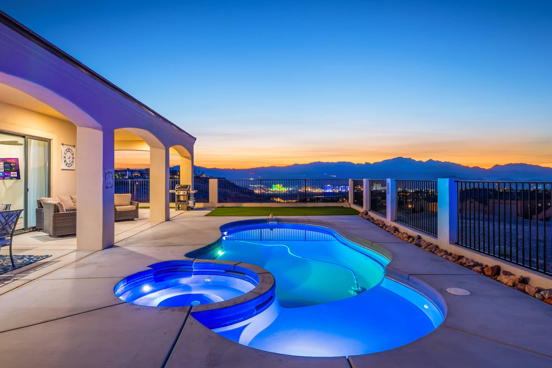 SunnyDayz pool and spa at twilight with Laughlin Strip views