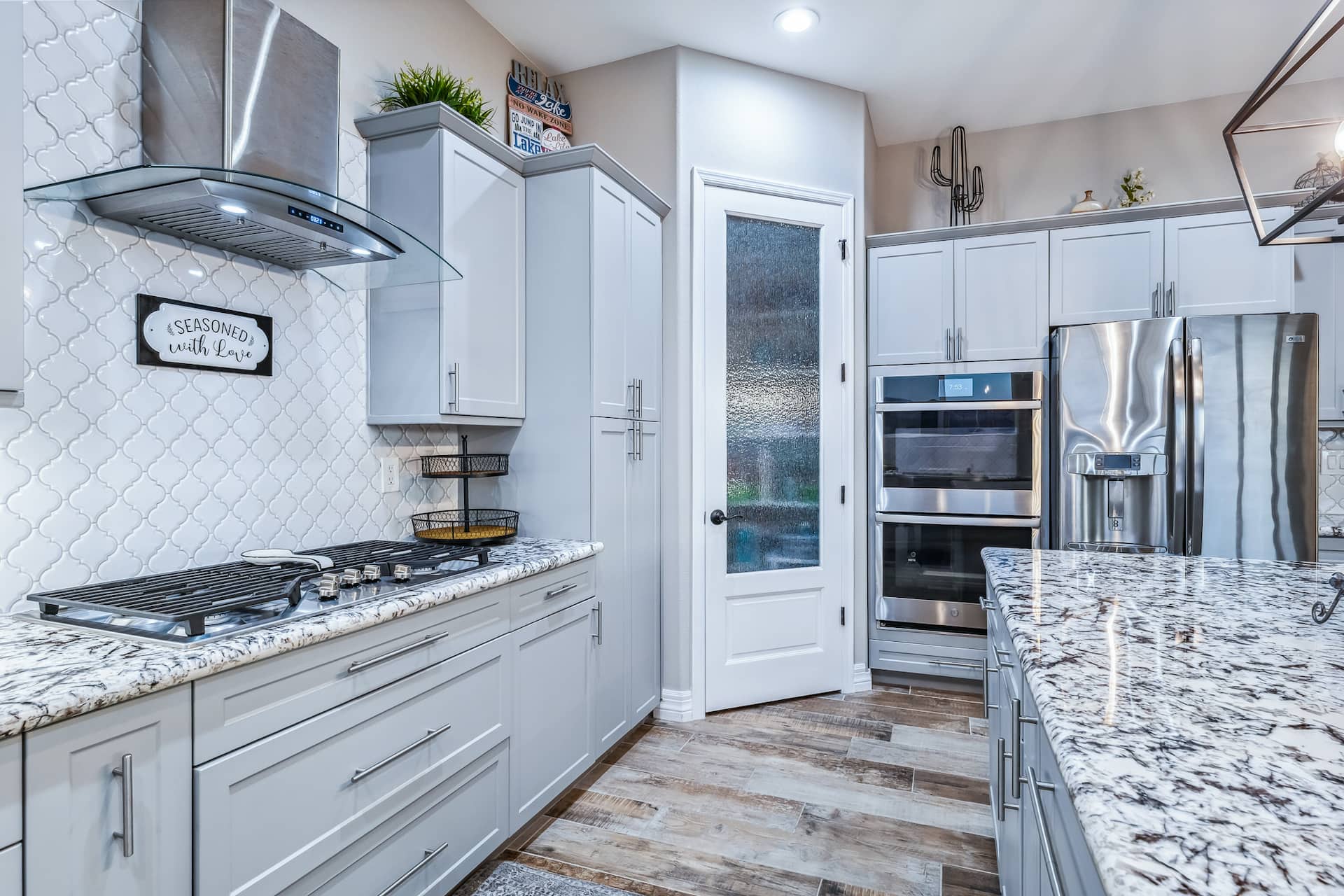 Gas range, double oven, and stainless appliances
