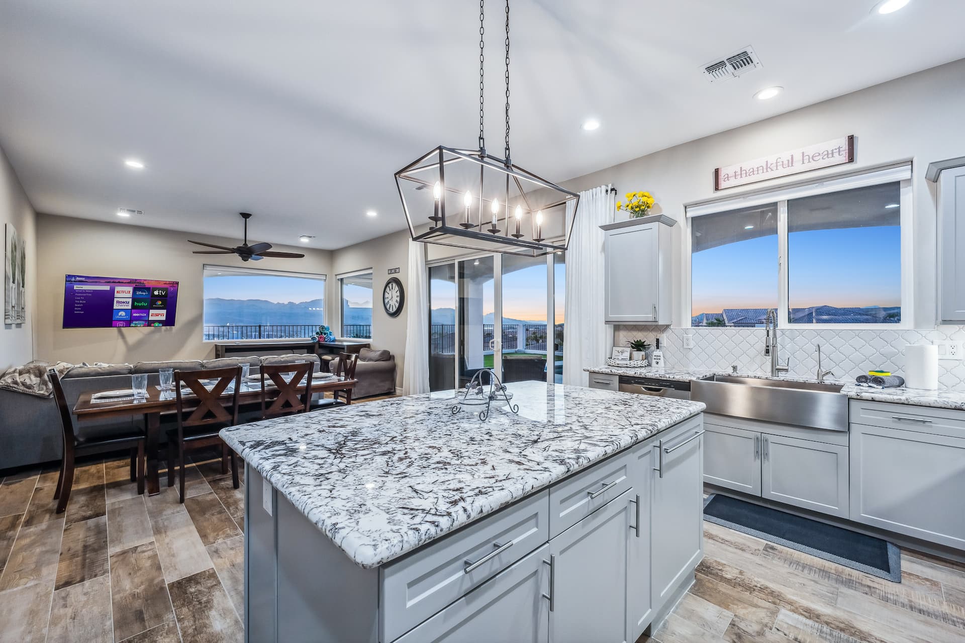 Open kitchen flowing into living and dining