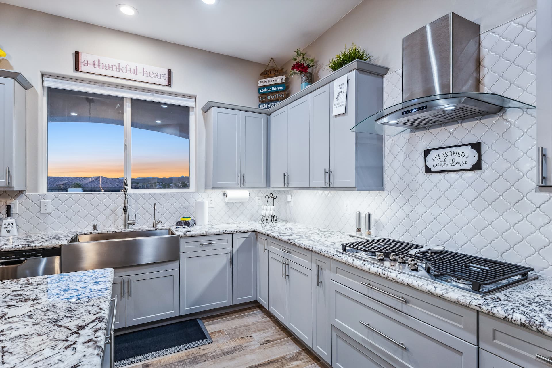 Kitchen with sunset views through windows